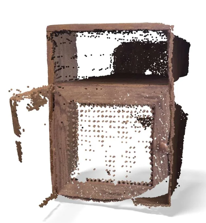 The cane cabinet as a dense colored point cloud, reconstructed from the photographs.