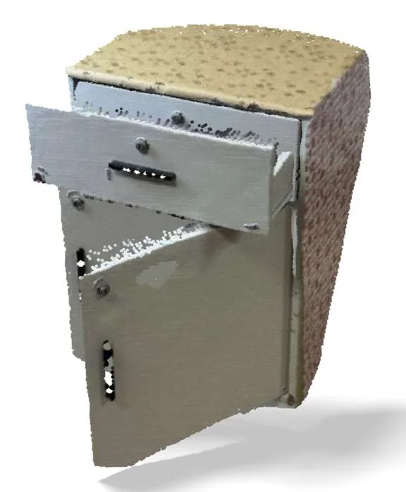 The metal cabinet as a dense colored point cloud, reconstructed from the photographs.